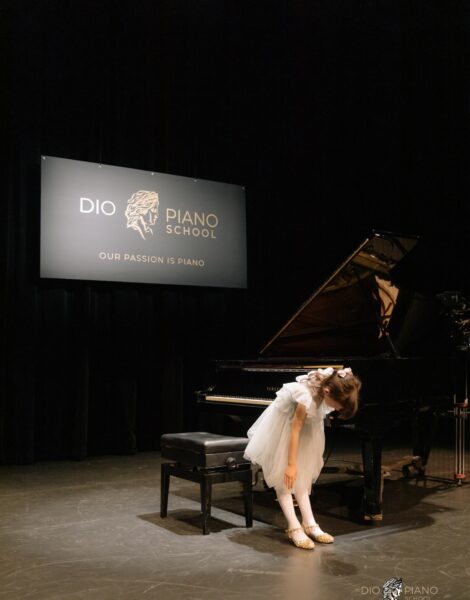 Piano Player Bowing on Stage